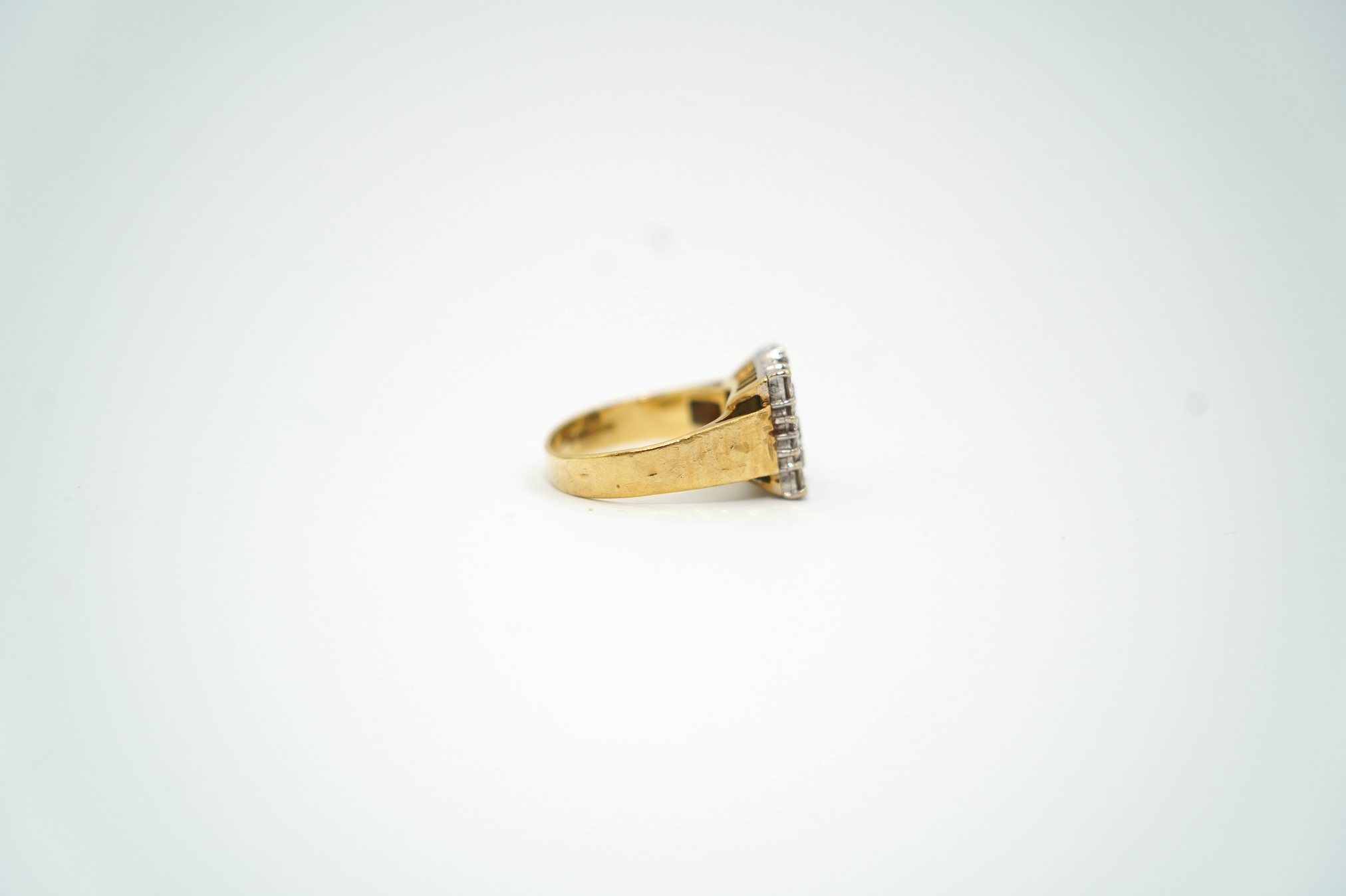 A modern textured 18ct gold and diamond cluster set tablet ring, size K/L, gross weight 6.8 grams.
